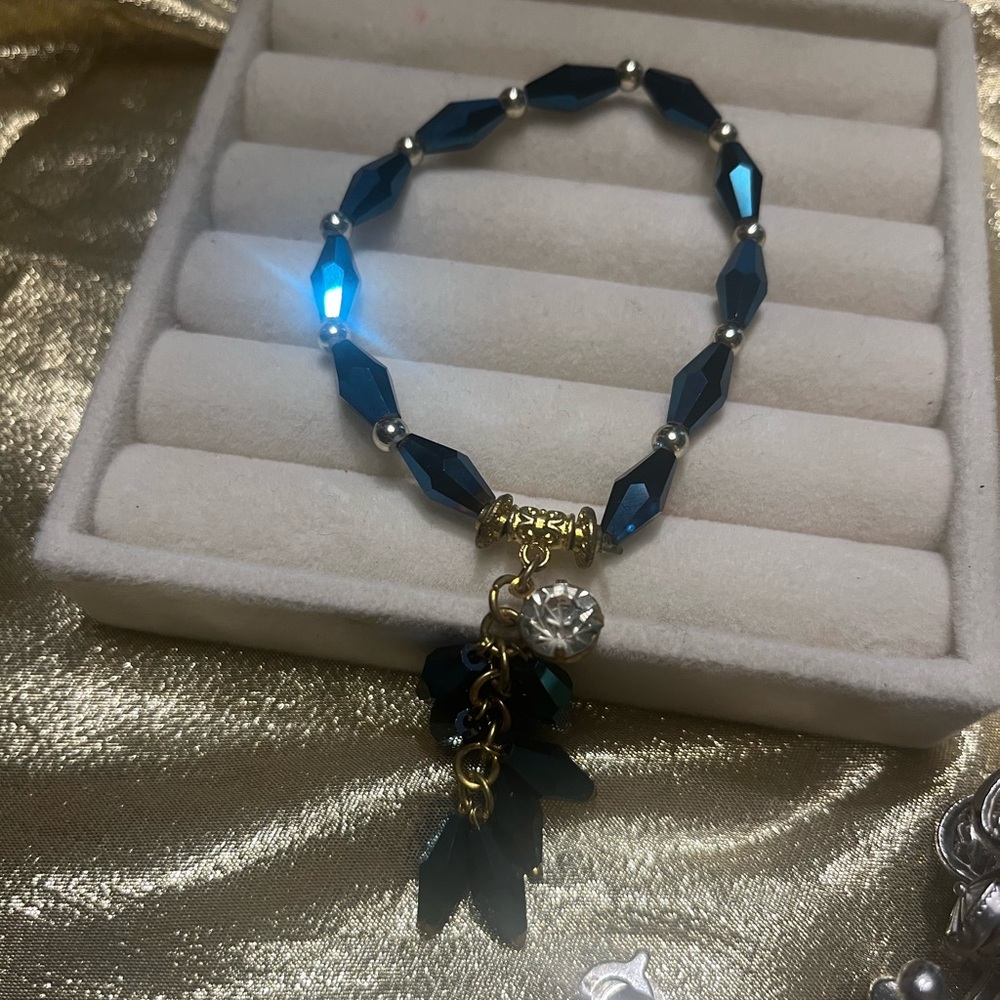 Elegant Black and Gold Bracelet with Charms